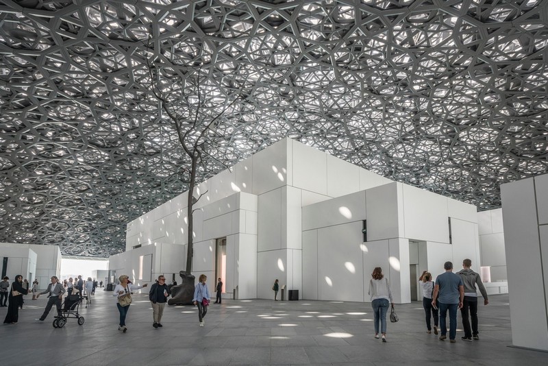 Interior space at the Louvre Abu Dhabi. Sunlight filtering through the dome creates a mesmerizing "rain of light" effect.Photo: Shutterstock